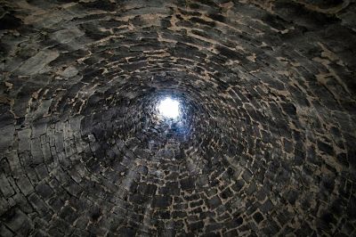 Ely, NV - Ward Charcoal Ovens - Inside, looking up
These ovens offer a strange view when standing inside.   Just the small door, and a chimney hole in the top.  They filled them up with dry mesquite, lit a fire and closed the door, and waited to harvest the resulting charcoal.
