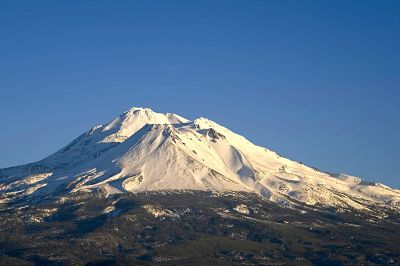 Mount Shasta Sunset from the North
On a trip home from Washington on New Years Eve in 2016 we stopped at the Weed Airport Rest Stop on I-5 South.  We were timed just right to catch the sunset on Mount Shasta on a mostly clear evening.  
Keywords: Olympuss E-1 Olympus Zuiko Digital 14-54mm f/2.8-3.5 ISO:100 ~1/500th sec @ f/7.1